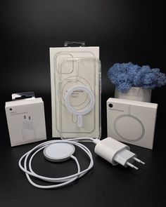 an ipod charger is shown in its packaging and the contents are also plugged into it