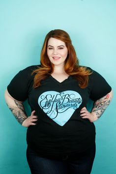 a woman with red hair and tattoos wearing a black t - shirt that says, always be my valentine