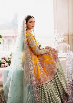 Yellow Blue Contrast Embroidered Pakistani Party Wear Sharara Kameez is a hand-crafted masterpiece to wear during the festivity. The beautiful details of tilla and Resham give a traditional touch to this stunning Sharara Suit. An embroidered dupatta gives a perfect finishing look to this masterpiece. Emboidered Kameez: Beautiful kameez in the alluring Yellow shade is a perfect choice to have your desired elegant look at the party. This kameez is gracefully adorned with beautiful work of crystals, pearls, and petals beads. Gota, kora dabka, and tilla enhance the glamour of this beautiful Pakistani Party Dress. Party Sharara: The embellished kameez is paired with a flared Sharara to have a stunning look at the magical event. The Sharara is adorned with embroidery and threads. The borders of Transitional Anarkali Lehenga With Dabka, Transitional Anarkali Lehenga With Dabka Details, Navratri Designer Dabka Choli, Designer Dabka Choli For Navratri, Navratri Designer Choli With Dabka Embroidery, Eid Chanderi Choli With Dabka Details, Yellow Long Sleeve Choli For Wedding, Designer Wear Dabka Work Choli For Transitional Season, Bollywood Style Georgette Choli With Dabka Detailing