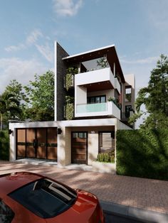 a red car is parked in front of a modern house with balconies on the second floor