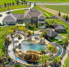 an aerial view of a home with a pool