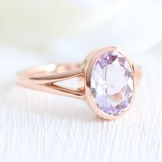 Oval Lavender Purple Sapphire Ring Rose Gold Solitaire Bezel Ring | La More Design Oval Solitaire Sapphire Ring In Rose Gold, Oval Rose Gold Solitaire Sapphire Ring, Rose Gold Oval Sapphire Solitaire Ring, Oval Rose Gold Sapphire Solitaire Ring, Wedding Rings With Pink Sapphire In Bezel Setting, Classic Rose Gold Sapphire Ring With Bezel Setting, Oval Bezel Set Amethyst Ring For Wedding, Oval Amethyst Ring With Bezel Setting For Wedding, Wedding Pink Sapphire Ring With Bezel Setting