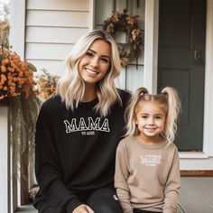 Embroidered Mini to mama shirt. We have the Mama version in the shop to match your sweatshirt. Here is a link to the matching shirt.  https://www.etsy.com/listing/1689817432/mother-daughter-gift-custom-embroidered I T E M ∙ D E T A I L S * 50% cotton, 50% polyester * Fabric weight: 8 oz/yd² (271.25 g/m²) * Air-jetted fleece fabric * Regular fit * Double-needle stitching on shoulders, armholes, neck, waistband, and cuffs * The fabric is OEKO-TEX Standard 100 certified P R O C E S S I N G ∙ & ∙ S Family Matching Sweatshirt For Fall, Family Matching Fall Sweatshirt, Family Letter Print Long Sleeve Sweatshirt, Family Occasion Sweatshirt With Letter Print And Long Sleeves, Family Occasion Letter Print Long Sleeve Sweatshirt, Fall Long Sleeve Sweatshirt, Cotton Sweatshirt For Fall, Mama And Mini, Mother Daughter Gifts