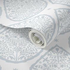 a white and blue wallpaper with an intricate design on it's surface,