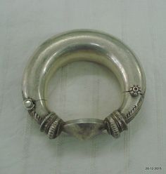 Vintage antique tribal old silver bangle bracelet from Rajasthan (India). great handmade design made of silver. One quarter-hinged part can be opened by central pin. good worn piece good for jewelry collection.Note - Please check pictures care fully for more detail.Inner diameter - 5.8 cm(2.3 inch) Inner circumference - 18.4 cm(7.2 inch) width max. - 3.3 cm(1.3 inch) weight  - 247 gramsmaterial - Silver and original old worn piece. Ceremonial Silver Openable Bangle, Antique Silver Openable Jewelry, Silver Openable Bangle For Festivals, Traditional Sterling Silver Bangle Bracelet, Unique Silver Bangle For Rituals, Traditional Silver Round Cuff Bracelet, Traditional Sterling Silver Bracelet For Ceremonial Occasions, Traditional Silver Bangle For Rituals, Unique Silver Bracelets For Rituals