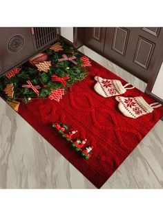 a red rug with christmas decorations and mittens on it in front of a door