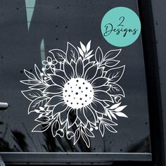 a white flower sticker on the side of a car