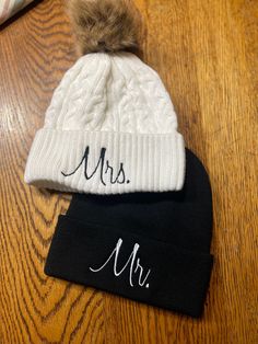 Mr. and Mrs. Embroidered Beanies Couples Knit Hats Wedding Gift Honeymoon Newlywed Anniversary Gift Ski Snowboard Warm Winter Hats Matching The skull caps are 100% acrylic and have a 3 inch folding cuff, these do NOT come with pom pom Faux Fur Pom Pom Toque * Acrylic * Cuff Toque (Faux Fur Pom Pom 12cm * Jacquard cable knit High Quality Embroidered Beanies: Embroidered in London, ON. Unisex: Perfect For Both Men and Women. Lightweight. 100% Acrylic. Cozy Fit: Soft and Warm Material. One Size. RE Fitted Embroidered White Hat, White Embroidered Fitted Hat, Adjustable Mini Hats For Winter Wedding, Black Wedding Hat For Winter, Black Winter Wedding Hat, White Embroidered Beanie Hat, Embroidered Wedding Hat, Leather Wedding Gifts, Christmas Monogram Shirt