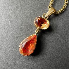 For best prices and offers, please visit our website: www.curiouslytimeless.com For sale a Georgian era 18K gold citrine pendant featuring two mesmerizing citrines, each with a fiery and sparkling orangy-red hue which gives them a very heart-warming appearance. The pendant features a beautifully faceted oval citrine at the top, measuring 8mm x 7mm, and a complementary pear-shaped citrine drop below, measuring 8mm x 12mm. Both stones are skillfully foiled on gold, a technique that was highly popu Birthday Pendant, Birthday Necklace Gift, Birthday Necklace, Georgian Era, Citrine Pendant, Heart Warming, French Antique, Style Expert, Necklace Gift