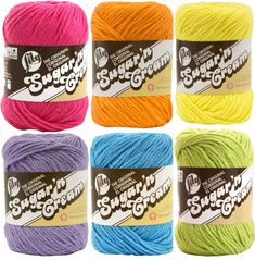 six skeins of bright colored yarn in different colors and sizes, each with the same