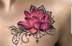 a woman's chest with a pink flower on it