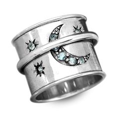 A stunning celestial sterling silver spinner ring that looks like the midnight sky. This wide-band spinner ring has an Aquamarine crescent moon with stars inset into the ring. It invokes mystery and beauty as it reminds us of the beauty of the night sky!Aquamarine can represent hope, happiness and it also connects us to the wisdom of water and the moon. Wear this ring with every moon phase to feel connected to the cosmos! Material: Genuine Sterling Silver 92.5 Gemstone: Aquamarine Ring size: Cho Silver Crescent Moonstone Ring In Celestial Style, Handmade Celestial Sterling Silver Crystal Ring, Mystical Silver Rings With Moon Phase, Mystical Silver Moon Phase Ring, Celestial Silver Ring With Moon Phase, Celestial Silver Crescent Ring, Silver Mystical Moon Phase Ring, Bohemian Moon Shaped Adjustable Rings, Celestial Crescent Silver Ring