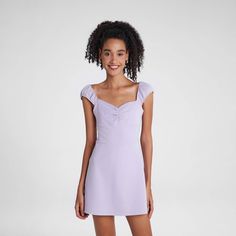 This skort mini dress combines style and comfort with its luxurious knit fabric and flexible design. The built-in open-back shorts and elastic band ensure easy movement, while the cinched bust detail adds a modern twist. Perfect for effortless chic with a hint of playful sophistication. Wild Fable™: A look for every story. Purple Dress Mini, Feminine Purple Mini Dress With Short Sleeves, Purple Short Sleeve Feminine Mini Dress, Casual Purple Sleeveless Mini Dress, Chic Purple A-line Mini Dress, Purple Sleeveless Mini Dress By Urban Outfitters, Purple L, Dresses Purple, Mini Tank Dress