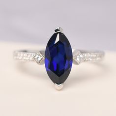 All HANDMADE ITEMS SHIP IN APPROX 8 DAYS Main Stone: Lab sapphire Main Stone Size: Marquise cut 6 mm x 12 mm Main Stone Weight: 2.19 carat Side Stone: CZ Height From The Ring Setting Bottom(to gemstone top): about 5.95 mm Width of Ring band Measure: gradually varied,about 2.1 mm Material: 925 Sterling Silver/14K White Gold/14K Yellow Gold/14k Rose Gold Engraved: Available For FreeNo more than 13 letters) Customized:Of course! Tell me what you want Includes With Order: All of my store items come Marquise White Gold Sapphire Ring, White Gold Marquise Sapphire Ring, Gift Marquise Cubic Zirconia Sapphire Ring, Marquise Diamond Cut Sapphire Ring Gift, Marquise Sapphire Ring With Diamond Cut For Anniversary, Gift Marquise Diamond Cut Sapphire Ring, Marquise Cut Sapphire Promise Ring, Marquise Cubic Zirconia Sapphire Ring For Anniversary, Marquise Sapphire Birthstone Ring For Anniversary