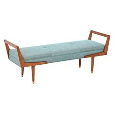 a wooden bench with a blue upholstered seat