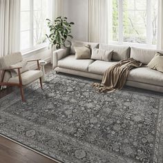 a living room with a large rug on the floor