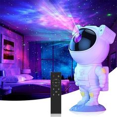 a remote control sitting in front of an astronaut's room with stars on the ceiling