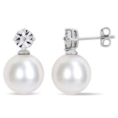 A classic look, these chic pearl drop earrings pair well with almost any attire. Fashioned in sterling silver, each anytime earring showcases a shimmering diamond accent - artfully set to enhance size and sparkle - atop a luminous 11.0-12.0mm cultured freshwater pearl. Buffed to a brilliant luster, these post earrings secure comfortably with friction backs. Formal Sterling Silver Diamond Earrings With Pearl Drop, Diamond White Sterling Silver Pearl Earrings For Formal Events, Diamond White Sterling Silver Pearl Earrings For Formal Occasions, Timeless Pearl Earrings With Diamond Accents As Gift, Timeless Pearl Earrings With Diamond Accents, Anniversary Pearl Drop Diamond Earrings, Anniversary Diamond Drop Earrings With Pearl, Diamond White Sterling Silver Pearl Earrings For Anniversary, Fine Jewelry Diamond Earrings With Pearl Drop For Anniversary