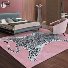 a leopard print rug is on the floor in front of a bed and two chairs