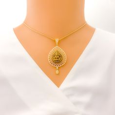 Embrace luxury with our Impressive Lakshmi 22k Gold CZ Pendant Set. Crafted from 14.5g of pure 22k gold, adorned with dazzling Cubic Zirconia. The pendant boasts a 2.2" length, complemented by matching 1" earrings with secure screw backs. Elevate your style with this exquisite 3-piece set. PRODUCT DETAILS Gold Purity(karat): 22k Item Weight(grams): 14.5 Item Finish: Yellow Gold Stone: Cubic Zirconia Pendant Length: 2.2" Matching Earrings: Included Earring Length: 1" Earring Post: Screw Back Numb Elegant 22k Gold Temple Necklace For Puja, Festive Gold Diamond Temple Necklace, Gold Diamond Temple Necklace Gift, Gold Diamond Temple Necklace For Gift, Gold American Diamond Pendant Jewelry, Traditional Gold Necklaces With Diamond Accents, Gold Necklaces With Intricate Designs In Cubic Zirconia, Gold Necklaces With Intricate American Diamond Design, Earring Post