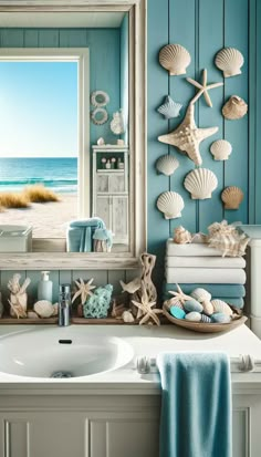 a bathroom sink under a mirror with seashells hanging on the wall above it