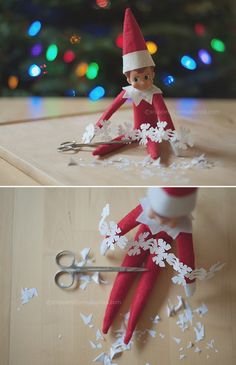 an elf is sitting on the floor with scissors and paper snowflakes in front of him