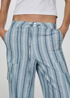 Trousers striped cargo pockets - Woman | MANGO USA Striped Trousers, Cargo Trousers, New Generation, Striped Pants, Stripes Design, Front Zipper, United Kingdom, Mango, Wide Leg