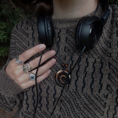 a woman with headphones on her hands