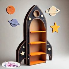 a cardboard rocket ship with space and stars on it