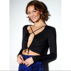 A Party Girl Necessity. Flirty Long Sleeve Top Featuring An Open Front Fastened With A Drawstring Cinched Cutout And Crisscross Straps Across The Chest. Bin 106 Chic Tops With Crisscross Straps For Night Out, Ruched Long Sleeve Crop Top For Party, Long Sleeve Ruched Crop Top For Party, Chic Tops With Crisscross Straps For Date Night, Summer Evening Top With Crisscross Straps, Summer Evening Tops With Crisscross Straps, Chic Cross-tied Crop Top For Night Out, Spring Crop Top With Crisscross Straps For Night Out, Trendy Ruched Party Tops