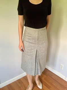 A chic and classy and light gray pencil wool skirt by French Connection. Well-constructed and preppy. Features a front pleat and waist button.  Condition: Excellent. No holes, missing buttons, tears or stains.  Size:  XS/S - Tag size is listed at 2.  Measurements: Waist: 26" Length: 26.5" Hip: 32 Classic Formal Skirt With Buttons, Gray Pleated Skirt For Workwear, Gray Lined Pleated Skirt For Work, Gray Elegant Pleated Skirt For Work, Elegant Pleated Skirt With Buttons For Work, Classic Fitted Pleated Skirt For Business Casual, Gray Fitted Pleated Skirt For Work, Elegant Gray Pleated Skirt For Work, Classic Gray Skirt For Workwear