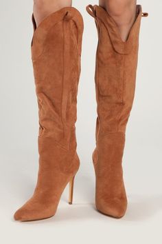 Step into the icon lifestyle with the Lulus Sayyna Tan Suede Pointed-Toe Knee-High Boots! Soft faux suede shapes these statement boots with a pointed-toe upper and a trendy seamed vamp. Shaft is 17.5"" for a knee high silhouette with two top pull tabs that meet a curved topline with an opening circumference of 14.5"". Classic stiletto heel lends some stylish height to your look! Slip-on design. 4" stiletto heel. Cushioned insole. Felted rubber sole has nonskid markings. Man made materials. Impor Tan Suede Knee High Boots, Suede Knee-high Boots With Pointed Toe, Fitted Western Suede Knee-high Boots, Western Knee-high Boots With Suede Lining, Brown Suede Knee-high Boots With Snip Toe, Western Boots Women, Stiletto Boots, Trending Boots, Lulu Fashion