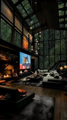 a living room filled with furniture and a flat screen tv sitting on top of a wooden floor