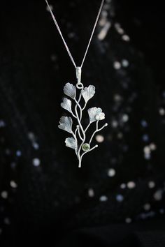 ITEM DESCRIPTION: The size H 5 cm x W 3 cm (2 x 1 inch). Weight - 3 g. Maidenhair fern is gentle and very beautiful plant. So it inspired me to create this unusual plant necklace. It looks natural and elegant at the same time. I made it of sterling silver and peridot. Tiny leaves repeat the natural shape and texture. This jewelry will not go unnoticed and will bring you many compliments. Ooak jewelry made by eco-friendly materials. This handmade necklace will come to you in a gift box - ready fo Silver Leaf-shaped Nature-inspired Necklace, Green Sterling Silver Flower Pendant Jewelry, Nature-inspired Leaf Shaped Sterling Silver Necklace, Nature-inspired Sterling Silver Leaf Necklace, Nature-inspired Sterling Silver Pendant Jewelry, Nature-inspired Sterling Silver Pendant Necklace, Delicate Green Sterling Silver Necklace, Delicate Green Sterling Silver Necklaces, Green Sterling Silver Necklace With Flower Pendant