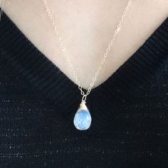 This dainty moonstone pendant necklace is gorgeous! It makes a beautiful bridesmaid gift or June birthstone gift! I wire wrap my gemstones by hand with gold filled wire for a unique look. It has beautiful flashes of blues and greens (as any quality moonstone should). It looks beautiful layered with other necklaces - check out my shop section to see some options! Shop Landon Lacey Jewelry » www.etsy.com/shop/landonlacey it's in the DETAILS . . . » 14k gold filled chain (or sterling silver) » 14k Delicate Moonstone Crystal Necklace As A Gift, Delicate Moonstone Crystal Necklace Gift, Moonstone Birthstone Necklaces For Jewelry Making, Dainty Moonstone Charm Necklace For Gift, Moonstone Teardrop Pendant Jewelry Gift, Moonstone Pendant Necklace Perfect For A Gift, Teardrop Moonstone Necklace With Birthstone, Moonstone Gemstone Crystal Necklace For Gift, Blue Moonstone Teardrop Necklace