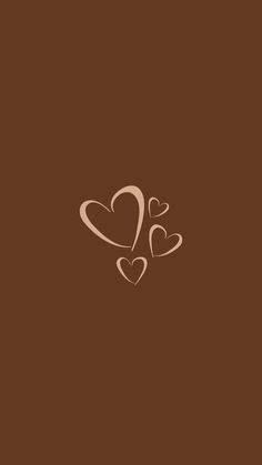 two hearts in the middle of brown background