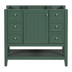 a green bathroom vanity with drawers and two sinks