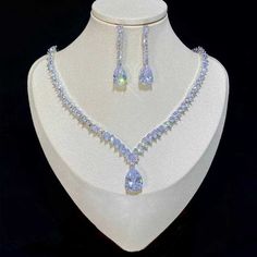 CZ%20Drop%20Wedding%20Jewelry%20Set%0D%0AComplete%20your%20dazzling%20bridal%20look%20with%20our%20fabulous%20CZ%20necklace%20and%20earring%20set.%20This%20dainty%20silver%20plated%20jewelry%20set%20is%20adorned%20with%20brilliant%20CZ%20crystals%20that%20will%20add%20glamour%20to%20any%20wedding%20or%20special%20occasion%20ensemble.%20The%20brilliant%20teardrop%20cz%20in%20the%20necklace%20measures%201%2F2%22%20long.%0D%0ASize%3A%20The%20necklace%20is%20about%2017%22%20long%20and%20the%20pierced%20earrings%20are%20about%201.3%22%20long.%0D%0AColor%3A%20Silver.%0D%0AStyle%3A%20nemy1009.%0D%0APlease%20allow%202-3%20weeks%20for%20delivery.%0D%0AShipping%20Policy.%0D%0AReturn%20Policy%0D%0A%26nbsp%3B%0D%0A. Luxury Bridal Necklace, Formal Jewelry, Prom Jewelry, Cubic Zirconia Jewelry, Luxury Bridal, Crystal Set, Engagement Jewelry, Wedding Jewelry Sets, Bridal Necklace