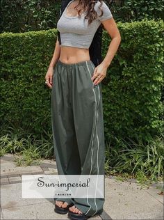 Style: Casual Waist Type: MID Decoration: Side Stripe Decoration: NONE Fabric Type: Broadcloth Pattern Type: striped Pant Style: Cargo Pants Material: Polyester Fit Type: LOOSE Length: Full Length Season: Summer Place Of Origin: China (Mainland) Closure Type: Elastic Waist Gender: WOMEN Front Style: Pleated 100% PolyesterSize TableS : Waist 64cm(25.2") Hip 118cm(46.5") Thigh 73cm(28.7") Length 104cm(40.9") M : Waist 68cm(26.8") Hip 122cm(48") Thigh 75cm(29.5") Length 105cm(41.3") L : Waist 72cm( Sporty Trousers For Summer, Sporty Summer Trousers, Sporty Baggy Parachute Pants For Summer, Green Sporty Parachute Pants For Summer, Sporty Long Pants For Summer, Sporty Summer Sweatpants, Striped Athleisure Bottoms For Spring, Sporty Wide Leg Parachute Pants For Summer, High Waist Sporty Sweatpants For Summer