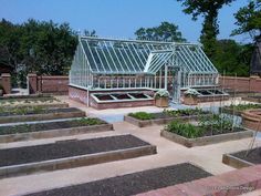 an outdoor garden with many different types of plants in the ground and on top of each other