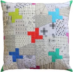 a pillow made with different colored squares on it