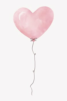 a pink heart shaped balloon floating in the air