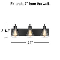 three light bathroom fixture with black finish and clear glass shades, shown from the wall