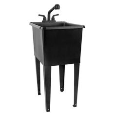 a black sink sitting on top of a metal stand