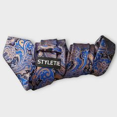 Treat yourself with a new pattern and splash of color to your look with this unique tie set. 100% Silk Handmade Package Includes: Tie, Pocket Square & Cufflinks. Length: 59" Width: 3.34" Warm iron if needed Dapper Blue Tie Suitable For Gift, Dapper Blue Tie For Gift, Dapper Blue Tie As Gift, Blue Standard Tie For Father's Day, Dapper Adjustable Blue Ties, Blue Tie For Father's Day Party, Blue Adjustable Suit And Tie Accessories For Formal Occasions, Formal Blue Adjustable Suit And Tie Accessories, Blue Ties For Father's Day