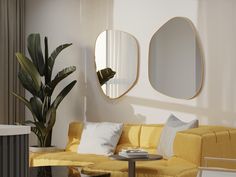 a living room with yellow couches and mirrors on the wall