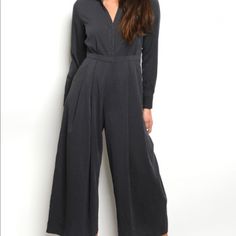 The Boss Lady Jumpsuit Will Change Up Your Regular Dress Pant And Shirt Look For Work. It’s Form Fitting Button Down Shirt And Lose Wide Leg Pant Gives That Elegant Look. Pair With Pointy Black Heels. Pattern Type: Solid Color Charcoal Style: Wide Leg Cropped Jumpsuit V-neck Jumpsuits And Rompers With Pockets For Work, Professional Pantsuit For Office Wear, Office Lady Long Sleeve Pantsuit For Career, Black Relaxed Fit Jumpsuit For Workwear, Solid Color Long Sleeve Business Casual Pantsuit, Office Wear Long Sleeve Pantsuit, Office Lady Long Sleeve Pantsuit For Workwear, Solid Color Office Lady Pantsuit For Workwear, Long Sleeve Business Casual Pantsuit