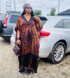 Adire Bubu With Fringe, Adire Silk Bubu Styles, Adire Silk Styles, Silk Adire Bubu Styles, How To Style Kaftan Dress, Kimono Bubu Gown, African Fringe Dress, Adire Silk Bubu Styles For Ladies, Tie And Dye Bubu Gown Styles