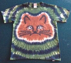 Custom made to order Cat tie dyed shirt. All of our shirts are 100% heavy weight cotton and the colors DO NOT fade! We have over 20 years experience in the tie dye business. We love it just as much today as we did 20 years ago!! We offer a variety of patterns and we take requests for stuff we don't already do. Contact us today and create your own one of a kind tie dye. We also offer wholesale pricing to business customers. Contact us today for wholesale pricing information. Last but not least we Cat Tie Dye, Earthy Tie Dye, Sunprinting Tshirt, Tye Dye Ideas, Tye Dye Clothes, Tie Dye Business, Tie Dye Ideas, Aesthetic Clothes Vintage, Cool Tie Dye Designs