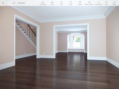 an empty room with hard wood flooring and white trim on the walls is shown